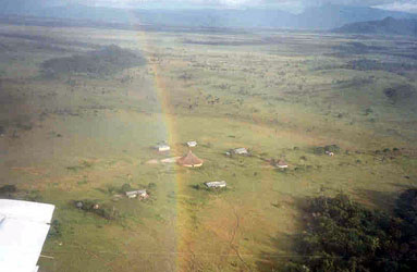 A rainbow cuts through the Sanema village as we fly overhead