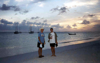 The sun setting behind Mike and me in Los Roques